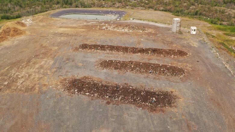 Aerial shot of four rows of compost. 