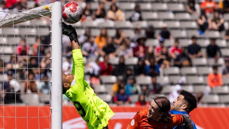 Forge FC goalkeeper Christopher Kalongo (29) jumps to tip away a shot from CF Montreal during first half Canadian Championship soccer action in Hamilton on Tuesday, May 7, 2024. 