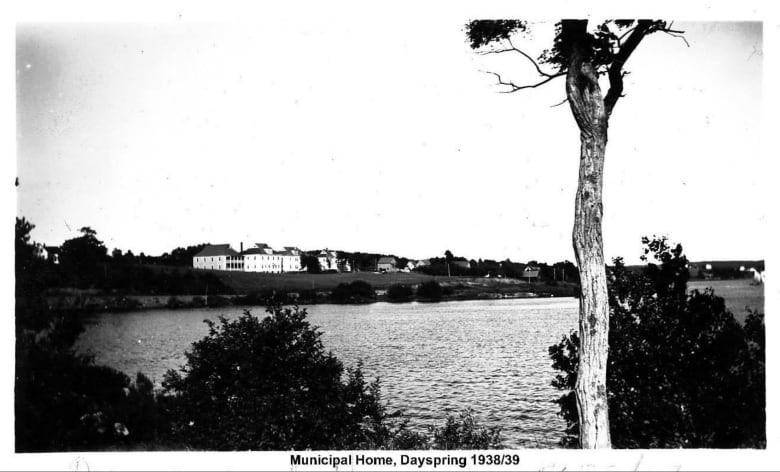 This black-and-white photograph shows the Lunenburg Municipal Home in Dayspring, N.S., from across the LaHave River.