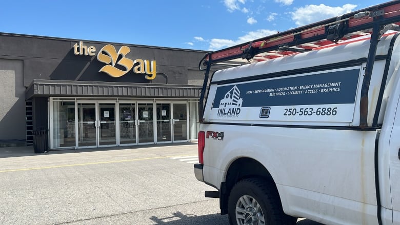 An HVAC repair truck is parked outside the Bay.