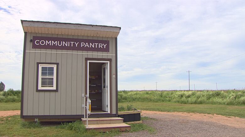 A wooden shed with the words 