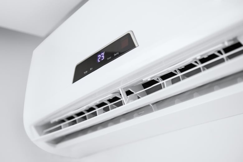 A white air conditioner set at 23 C