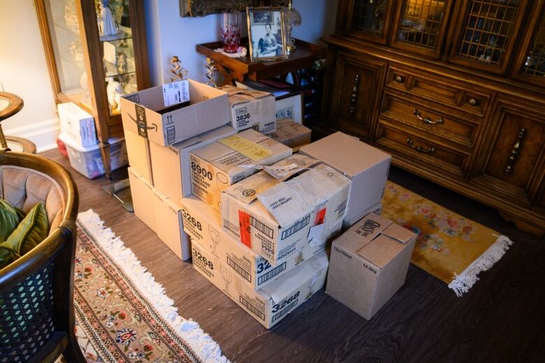 Boxes of wine and glasses in the apartment of Colin Oates for his wedding Saturday to Suzanne Scott in London, Ont.