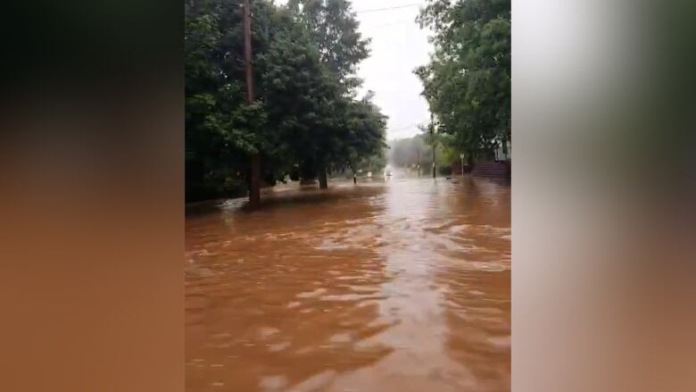 Water covers Main Street in Wolfville during a flash flood on July 11, 2014. 