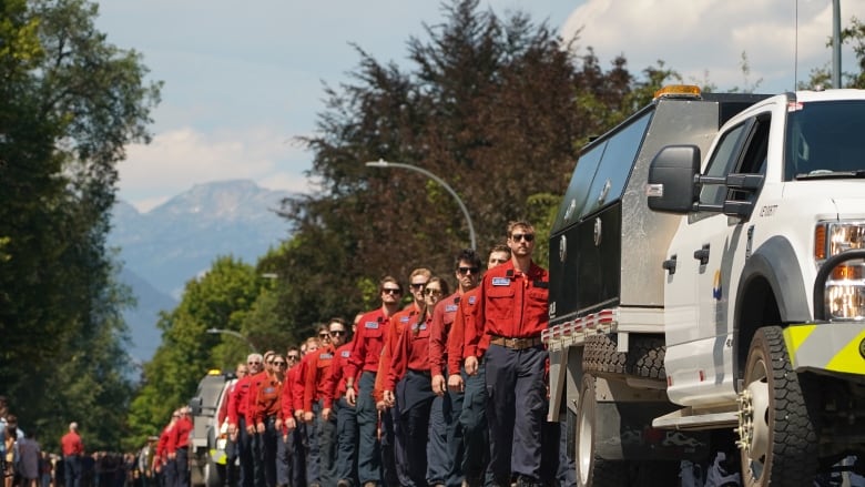 Hundreds of wildfire fighters marching silently last year at Dale's funeral in their signature red shirts. 