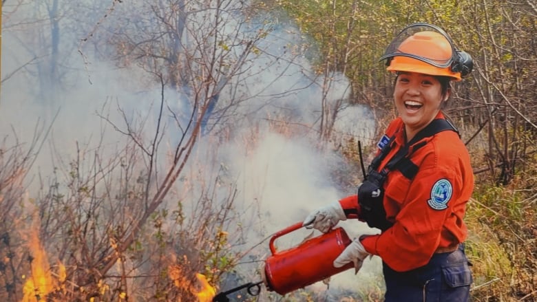 A wildfire fighter on scene fighting a blaze