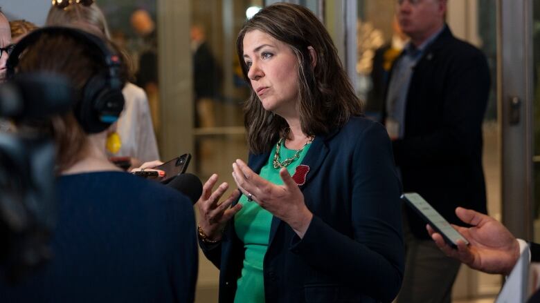 Alberta Premier Danielle Smith speaks with reporters before a meeting between Canada's premiers and Indigenous leaders at the Council of the Federation meetings in Halifax on Monday, July 15, 2024.