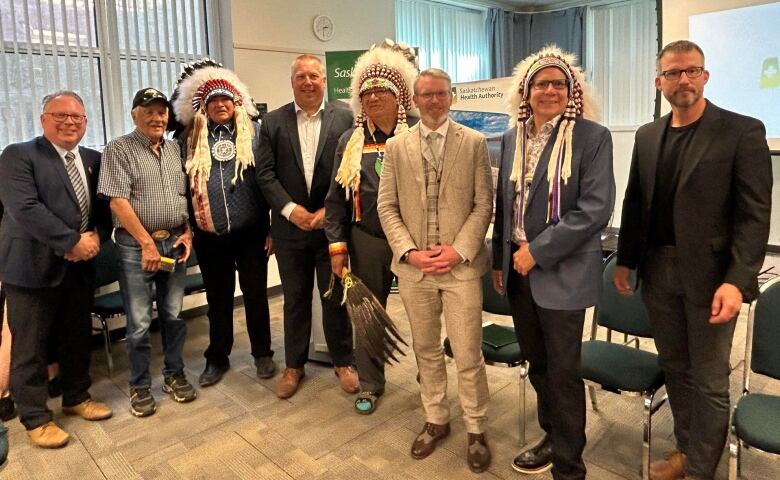 James Smith Cree Nation Chief Kirby Constant (third from left) and Minister of Health Everett Hindley (third from right) stand with other chiefs and dignitaries.