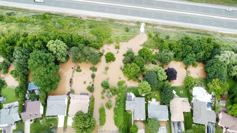 Aerial photo of water flowing into backyards