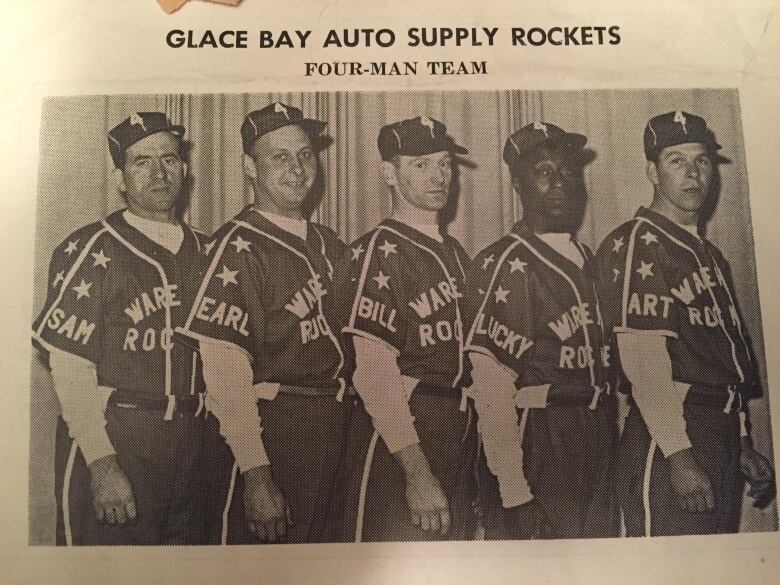 An old black-and-white photo shows five men standing together wearing baseball uniforms. The title above says Glace Bay Auto Supply Rockets: four-man team.