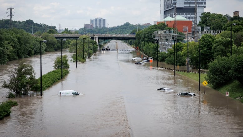 Cars on a flooded highway.