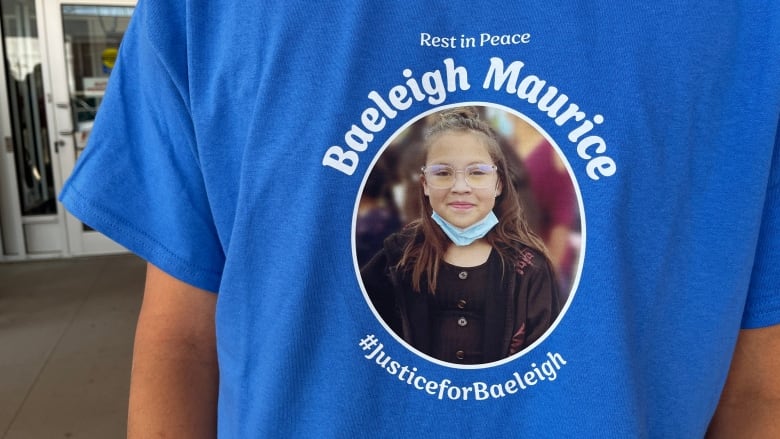 A blue shirt with Baeleigh Maurice's face on it