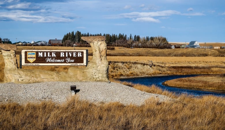 A sign is pictured that reads Milk River.