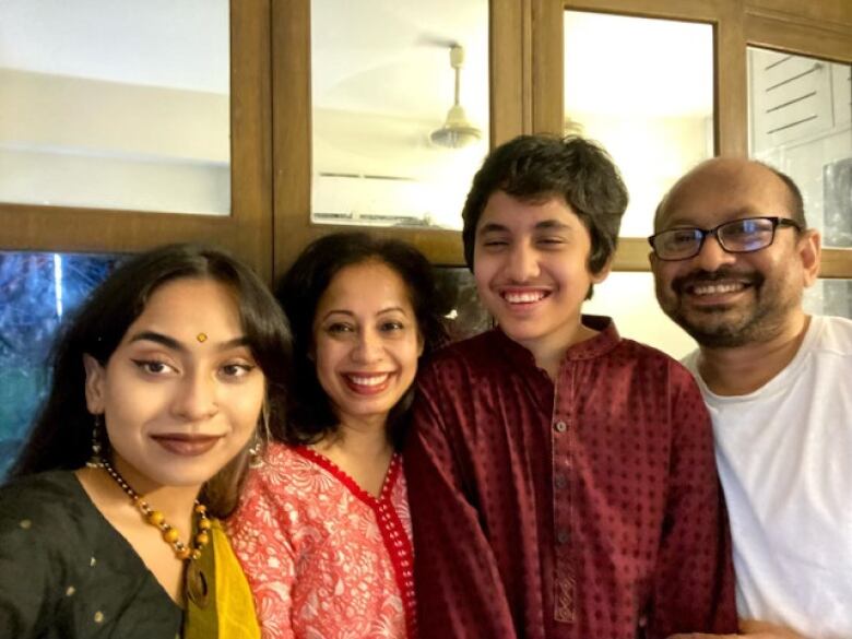 A Bangladeshi family poses for a selfie. 