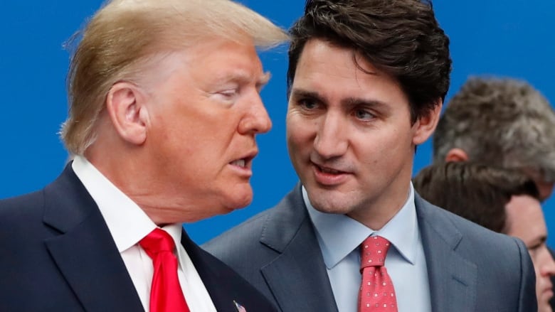 Former U.S. president Donald Trump, left, and Prime Minister Justin Trudeau talk prior to a NATO round table meeting in December 2019.