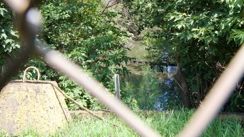 water channel seen through fence