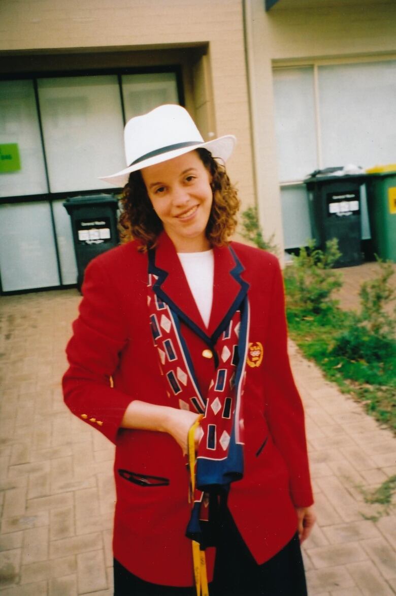 A woman in a red jacket