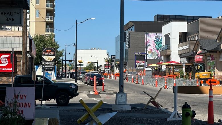 33rd Ave. in Marda Loop marked off with detour signs and fences.