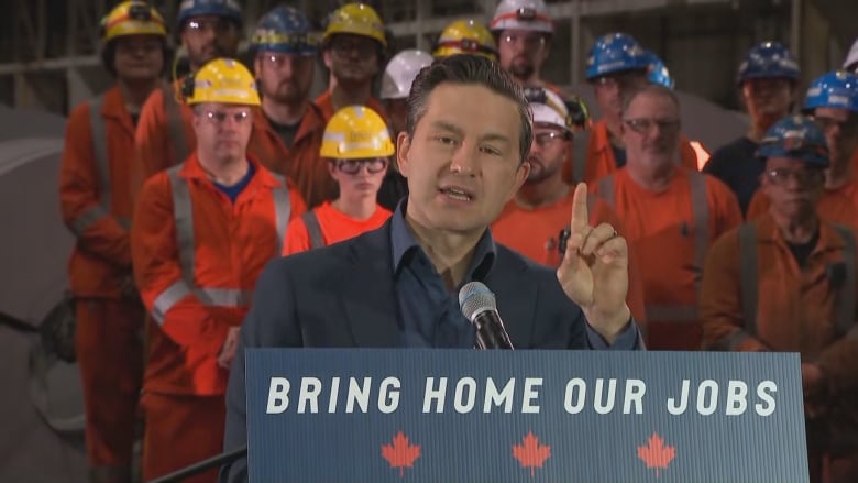 A man speaking at a podium.