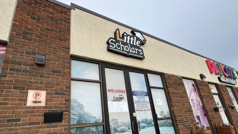 A view of a facade of a building with the text 'Little Scholars' visible. 