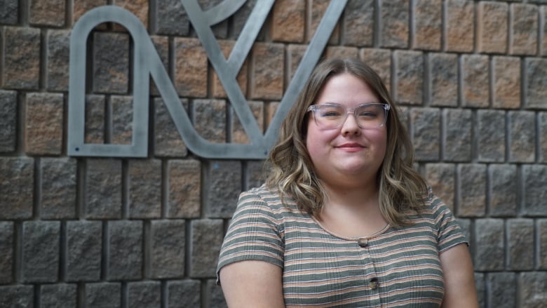 McKayla Fay, stands by the church