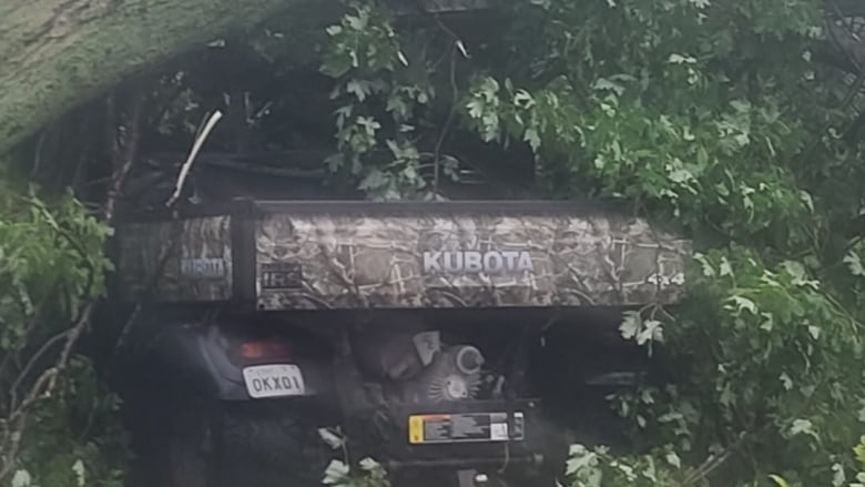 An ATV hit by a large downed tree limb in Chatham-Kent, Ont., from an early August storm.