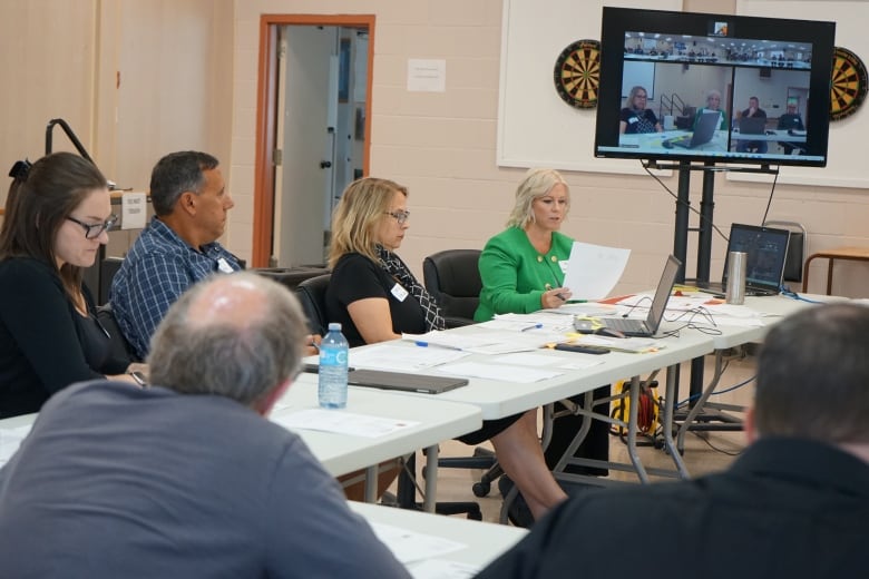 Nairn CAO Belinda Ketchabaw (right) reads a resolution during Nairn's council meeting on Monday.