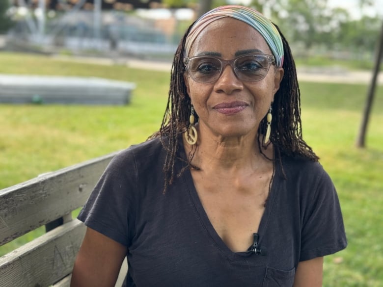 Leslie McCurdy sitting on a park bench.