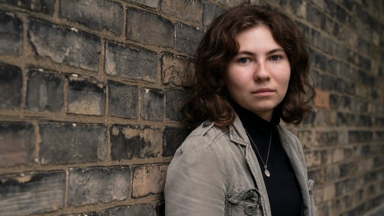 Olivia Tocher, a 17-year-old who is now a CAMH advisor, poses for a photo outside of CAMH's campus in Toronto, Tuesday, Aug. 20, 2024.