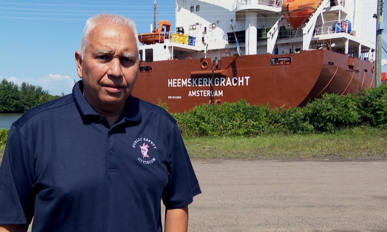 man in front of boat