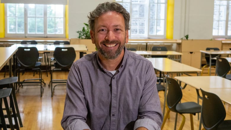 Man smiling in classroom