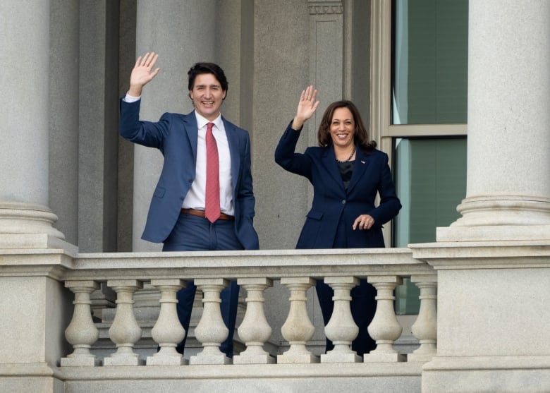 Prime Minister Justin Trudeau and U.S. Vice-President Kamala Harris wave from the balcony outside her office Thursday, November 18, 2021 in Washington, D.C.