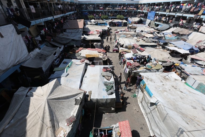 Makeshift tents and laundry line this school in Gaza used as a shelter.