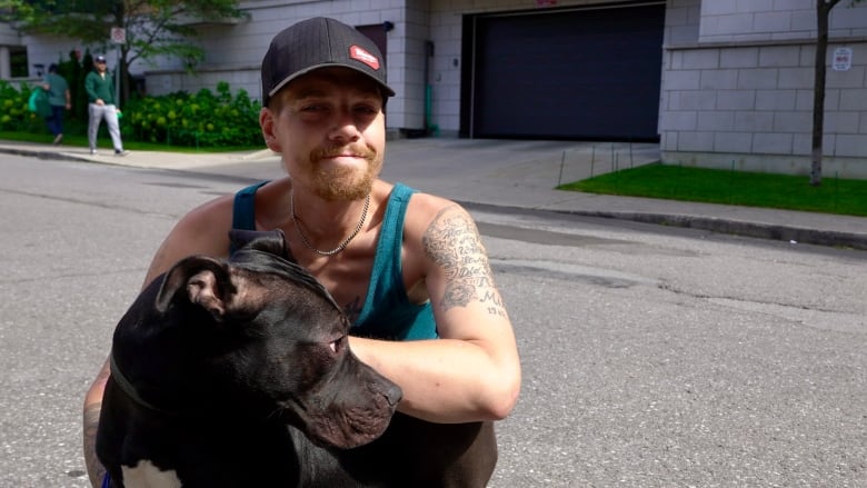 A man standing with a dog