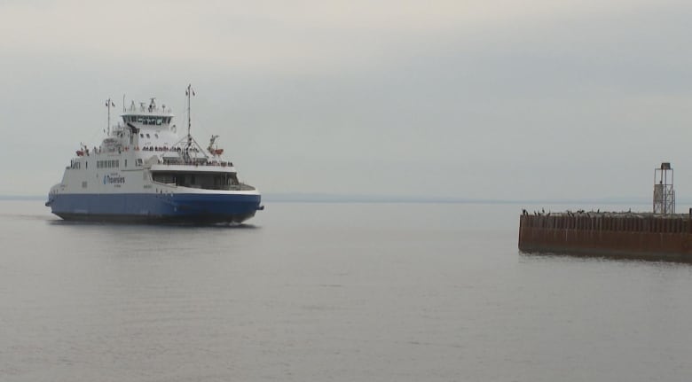 The MV Saaremaa sails into the wharf on a calm day.