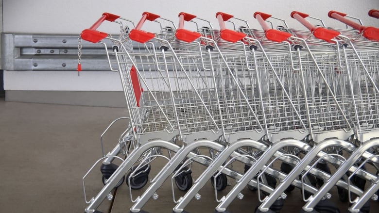 A line of stacked shopping carts.