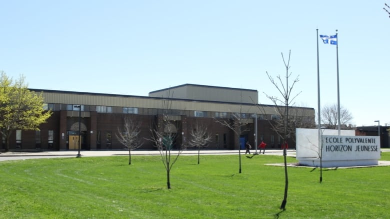 the outside of a high school in the spring