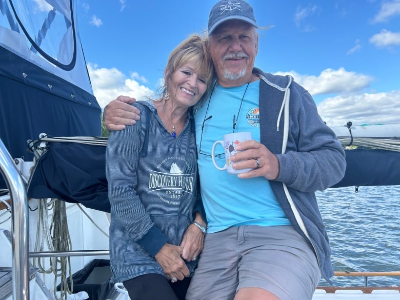 couple posing together on a boat