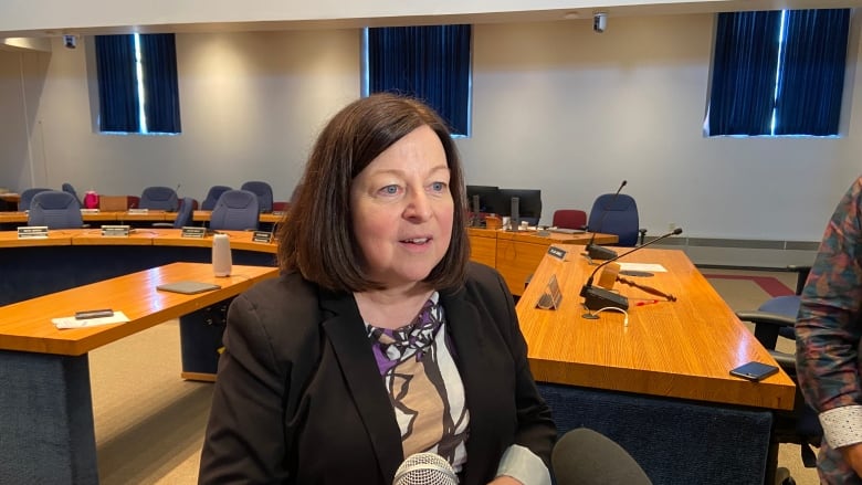 Charlene Sharpe speaks inside Fredericton council chambers.