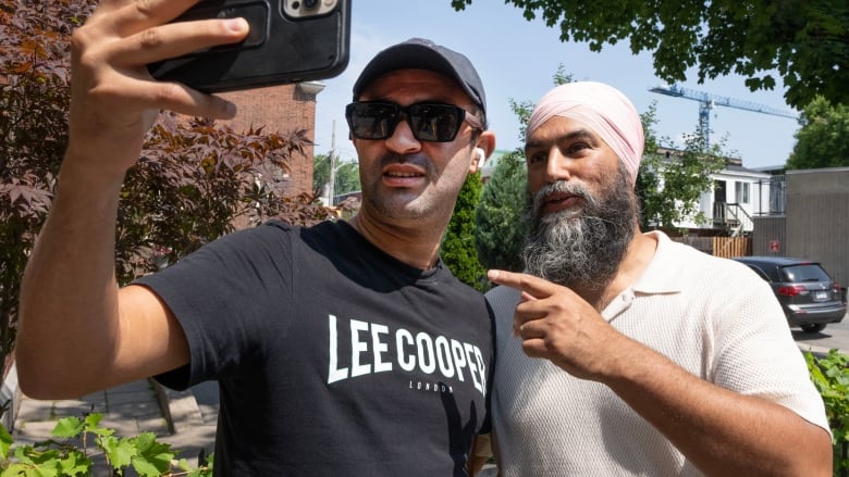 NDP leader Jagmeet Singh takes a selfie with a passer-by while campaigning Monday, July 29, 2024 in Montreal. A federal byelection will be held in the riding of Lasalle-Emard-Verdun on Sept. 16, 2024.