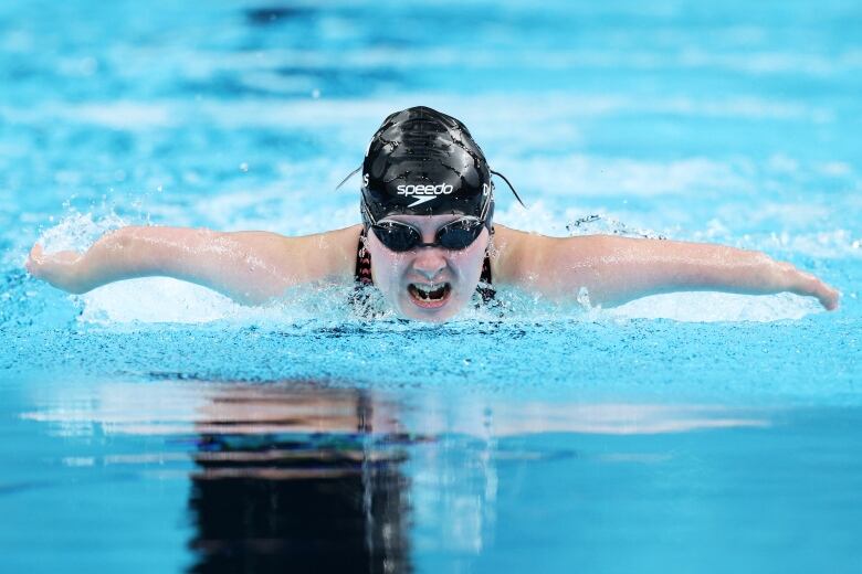 A swimmer is seen in action during competition.