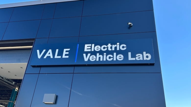 A sign that says Vale Electric Vehicle Lab.