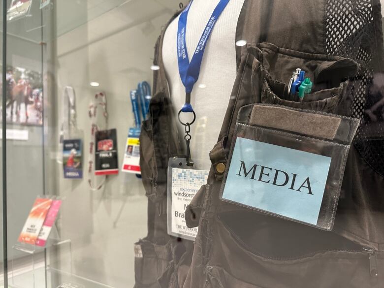 Media equipment in a glass case at a museum.