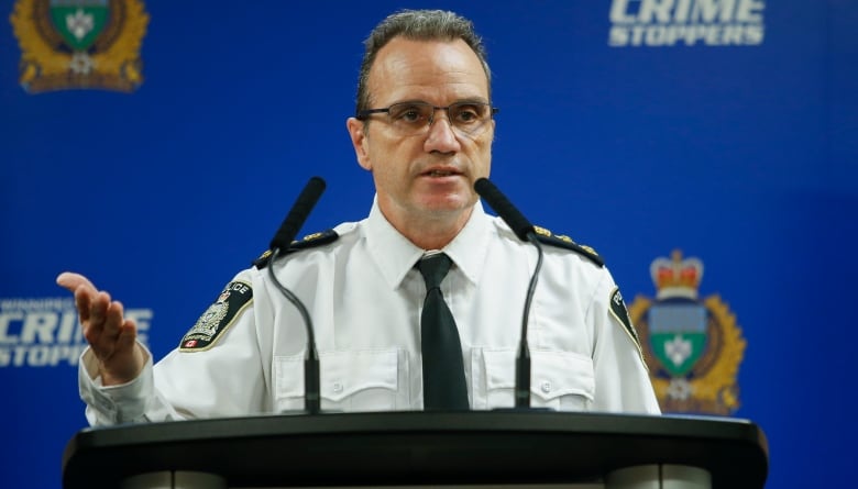 A police chief stands at a podium.