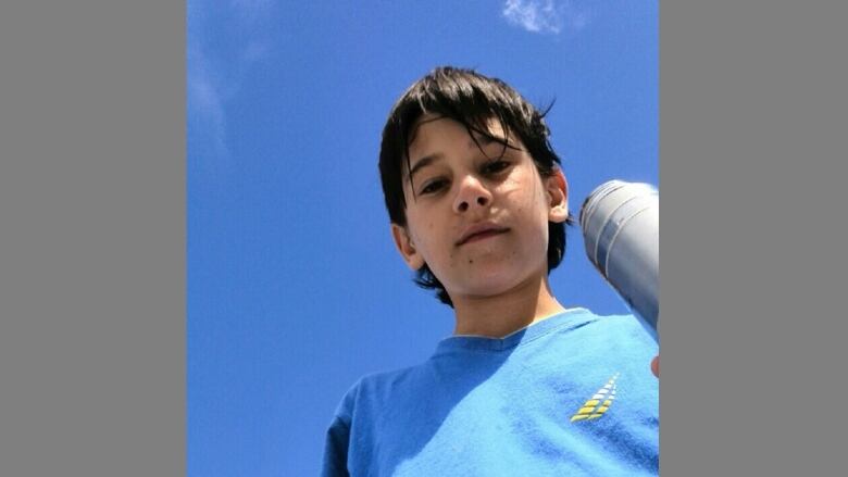 A boy with a water bottle.