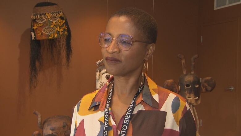 Woman in front of an art exhibit