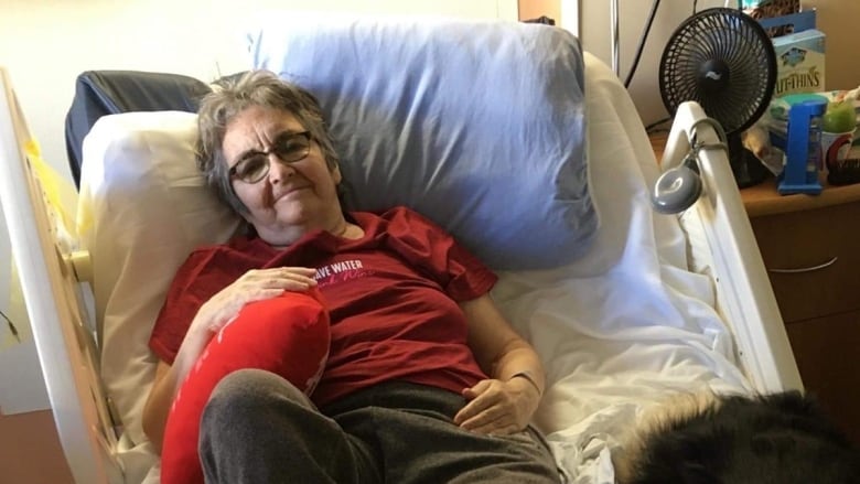 Velda MacKenzie in a hospital bed.