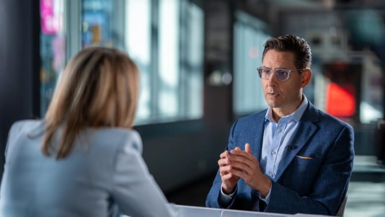 Michael Kovrig siting down for an interview with CBC News Chief Correspondent Adrienne Arsenaul