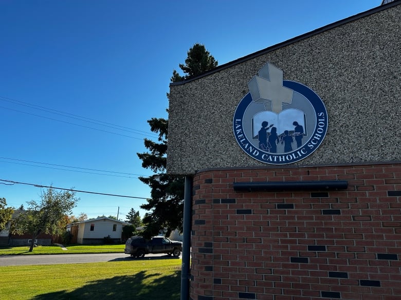 A brick building has a sign that says 