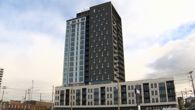 A tall apartment building is shown. 